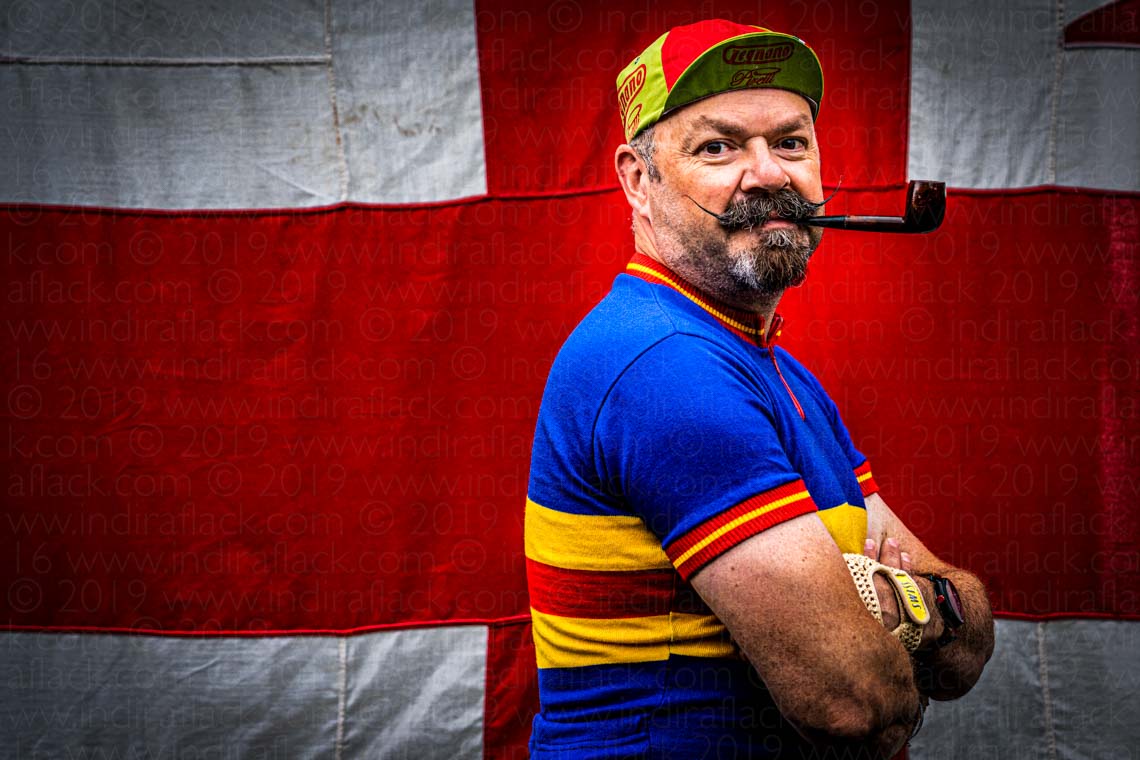 Man with pipe in Vintage Cycling gear for Eroica Britannia at Goodwood Revival 2021 photographed by portrait photographer Indira Flack